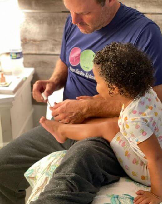 Brian Musso with his child.
